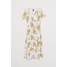 H&M Kopertowa sukienka we wzory 0714828001 Biały/Kwiaty
