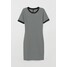 H&M Dżersejowa sukienka 0681176011 Czarny/Białe paski