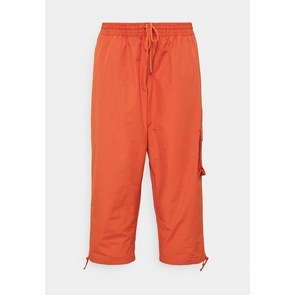 Nike Sportswear CLASH PANT Spodnie materiałowe light sienna/healing orange NI121S039