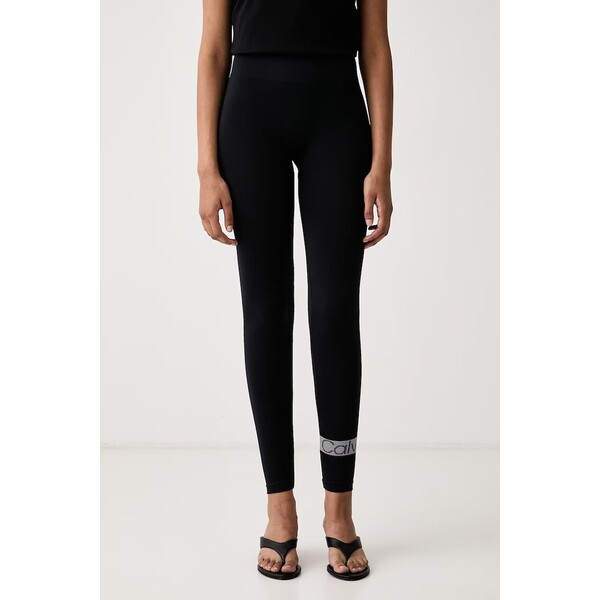 Calvin Klein legginsy damskie  czarne low waist 701241811